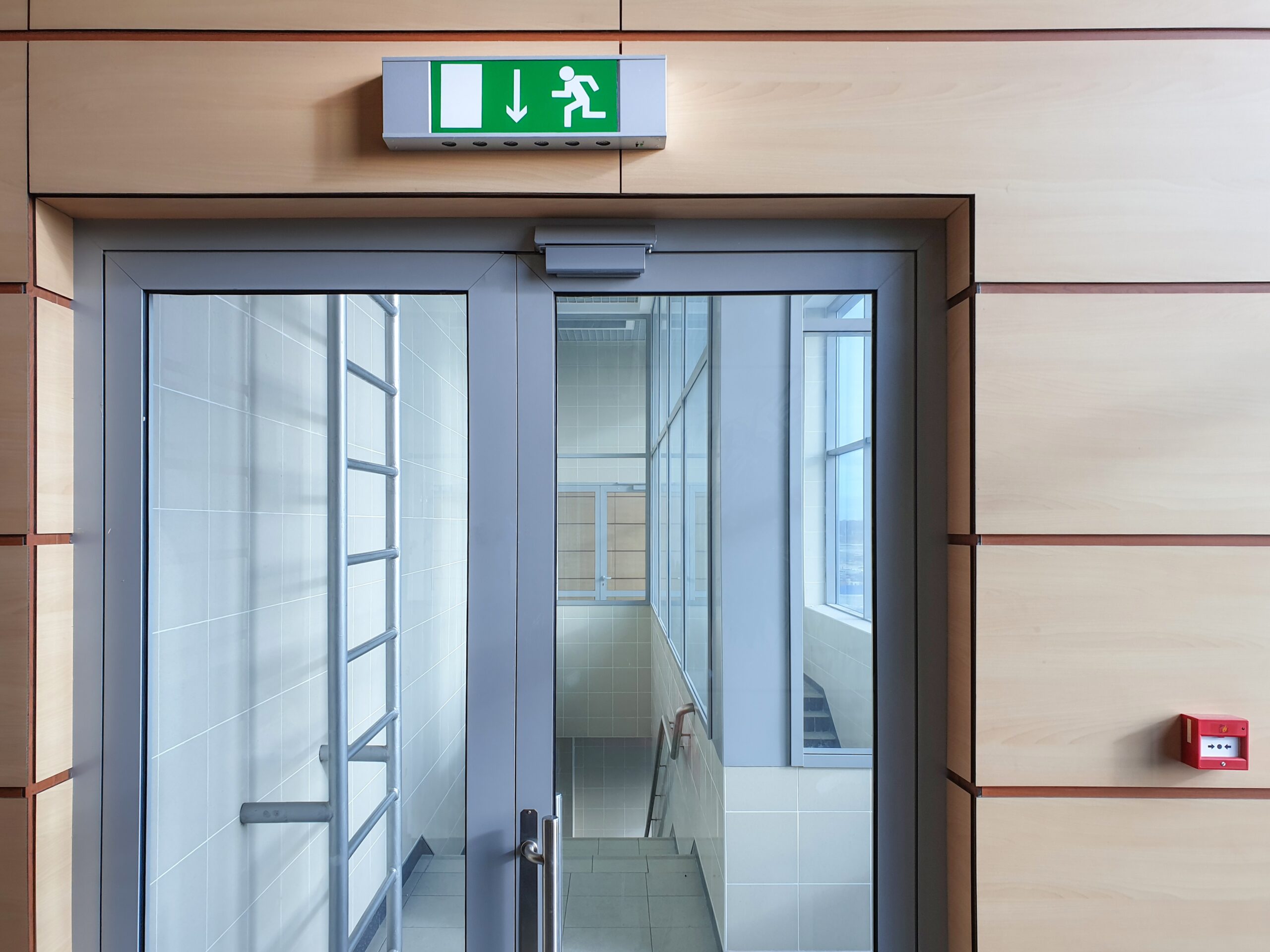 Emergency,Exit,With,Glass,Door,In,Airport,Office,Building.,Emergency